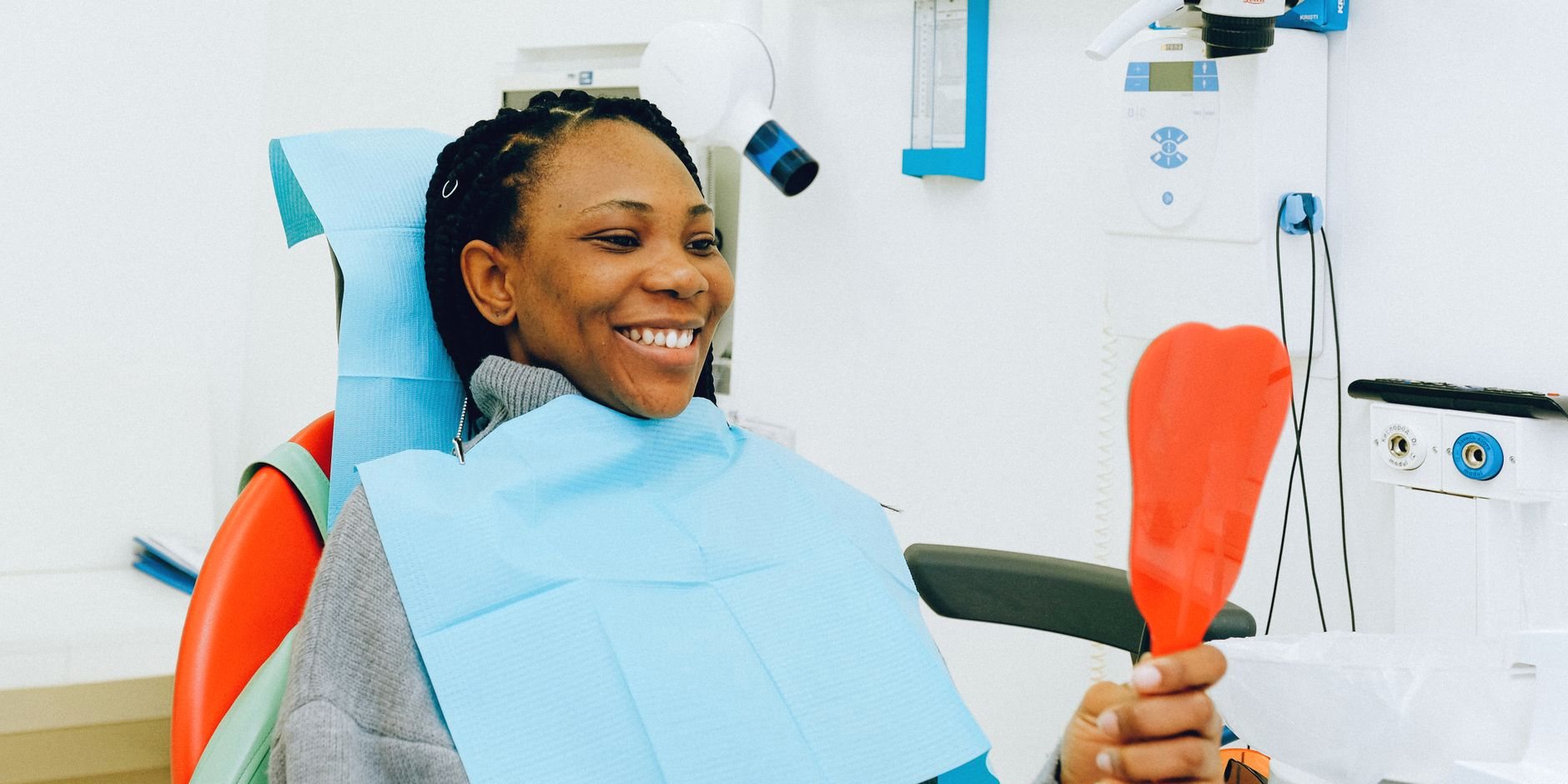 A patient smiling in the treatment chair
