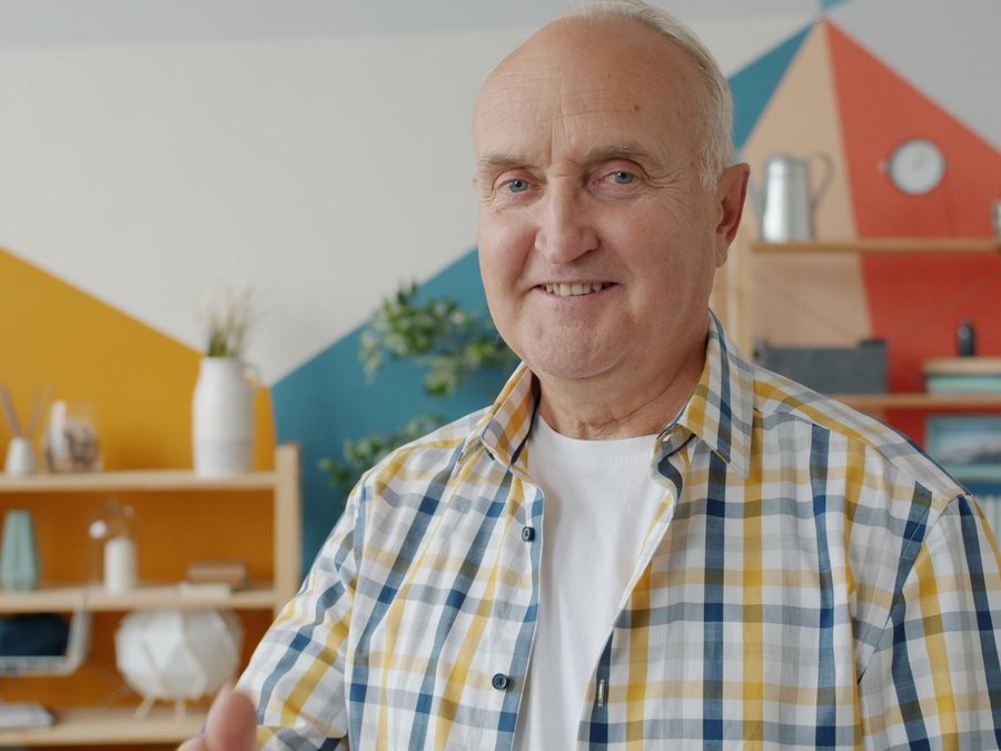 An older man smiling